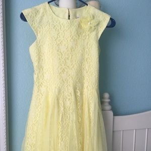 Girl’s bright yellow lace dress